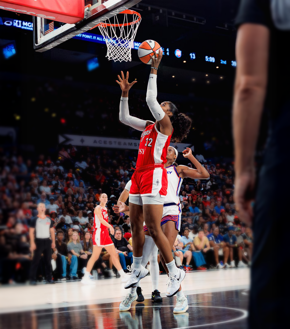 Cheyenne Parker-Tyus shooting during a basketball game
